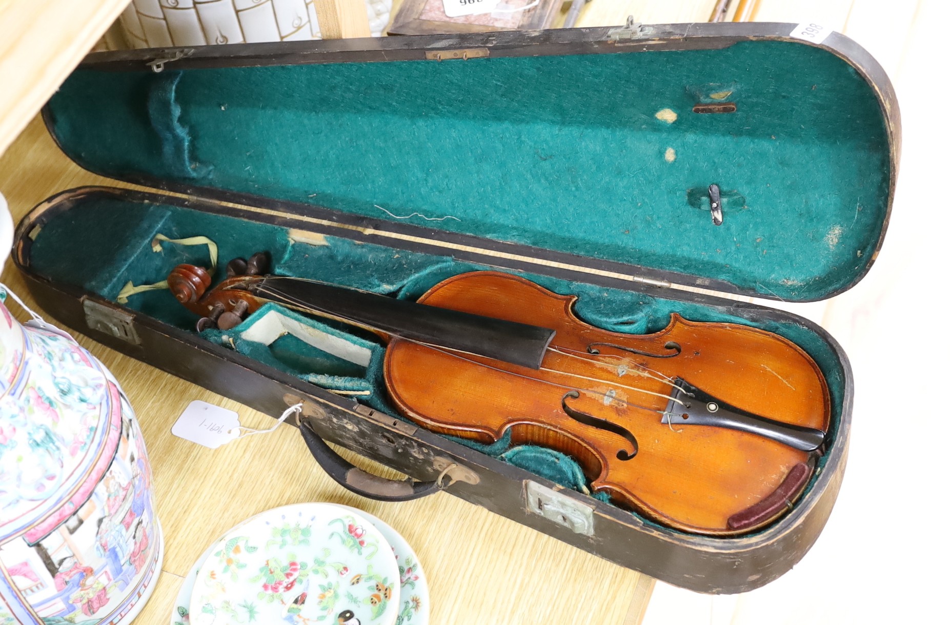 A cased 19th century French violin, back 34cm